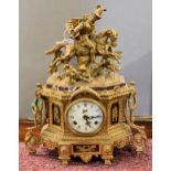 A brass and marble continental style mantle clock marked 'Walt' to dial.