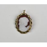 A glass and 9ct gold cameo brooch of a classical maiden.