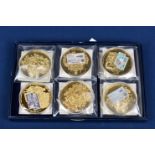 A collection of eleven 2010 banknote coin/medallions with certificates.