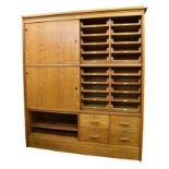 A large oak and pine haberdashery shop cabinet 1940s-50s, a 'Patent "Kwikserving" Fixtures'