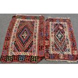 Two Turkmen Kilim rugs of very similar design, the madder field with stylised repeating patterns,