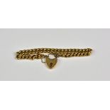 A 15ct rose gold curb link bracelet with heart shaped padlock clasp (inscribed) - 15g.
