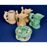 A collection of early 20th century novelty Sylvac pottery comprising of two heron handled jugs,