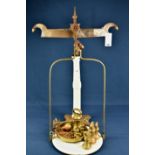 A set of shop beam balance scales of massive proportions, cast iron and ceramic with brass