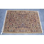 A Persian style rug. 78 x 55 ins