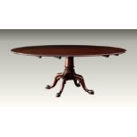 A large, good quality Georgian style mahogany single pedestal dining table fourth quarter 20th