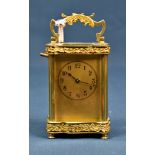 A French gilt brass Louis XV Doucine cased carriage clock timepiece C.1900, the gilded face with