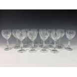 A set of twelve cut glass white wine glasses. (12)