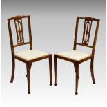A pair of Edwardian inlaid beechwood bedroom chairs. (2)