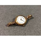 An antique ladies 14ct gold cased wrist watch with sprung rolled gold strap (not working, cracks