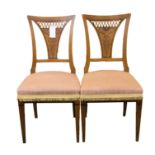 A pair of Biedermeier satin walnut and ebony inlaid side chairs first half 19th century, the