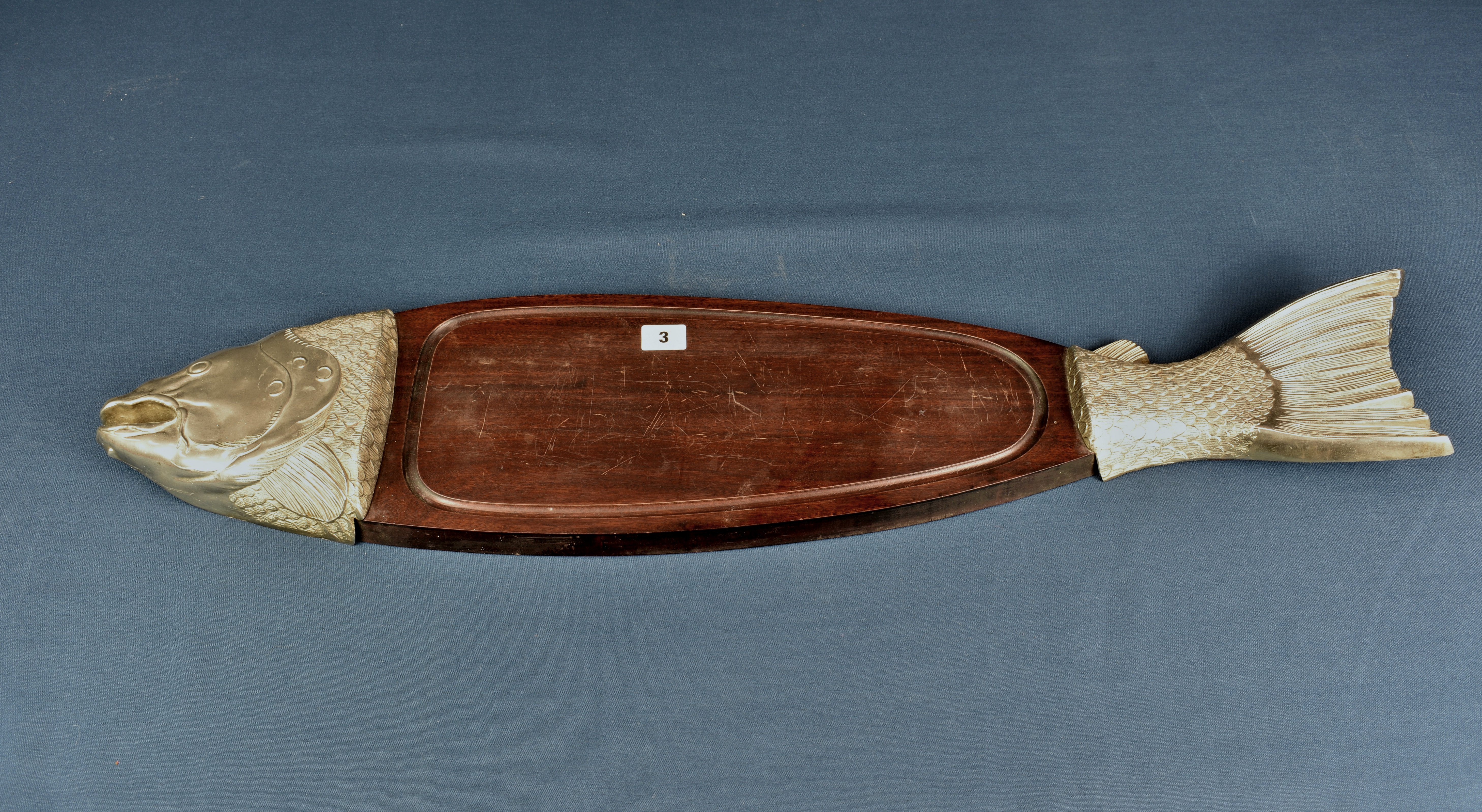 A modern mahogany and plated metal salmon serving platter.