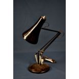 A vintage black painted anglepoise lamp