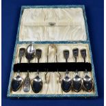 A cased silver spoon and tong set John Round & Son Ltd, Sheffield, 1934, having bright cut foliate