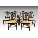 A set of six mahogany shield back dining chairs in the George III Hepplewhite style 20th century,