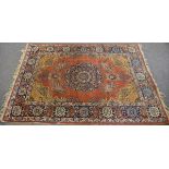 A Qum style rug the central 16 point dark blue pendant medallion on a madder ground, with buff