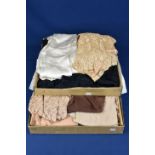 Various early 20th century women's clothing to include dresses, bolero, cape, nightgown and a nude