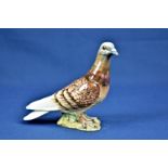 A Beswick racing pigeon, no. 1383, impressed and printed factory marks, 5½in. high.