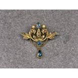 A Victorian 15ct yellow gold, London blue topaz and seed pearl brooch, the openwork brooch with