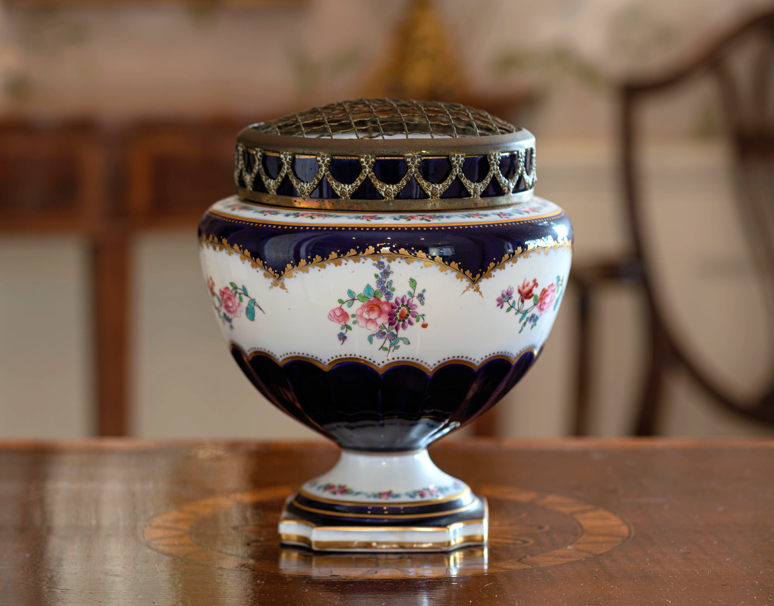 A Crescent China rose bowl, 1920s, decorated with flower garlands and sprays on cobalt blue