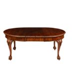 A Queen Anne style figured walnut wind-out extending oval dining table, 1920s-30s, with single