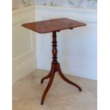 An early 19th century rosewood and mahogany tilt-top tripod table, the rectangular rosewood top on a