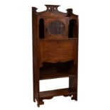 An oak Arts & Crafts style student's bureau, c.1900, the shaped, pierced three quarter galleried