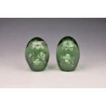 A pair of Victorian glass dump weights with sulphide floral inclusion, each with a floral spray in