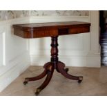 A late Regency inlaid mahogany card D-shaped card table, the ebony strung foldover top over a tablet