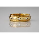 An 18ct yellow gold and diamond set wedding band, studded with eight 0.20ct brilliant cut diamonds