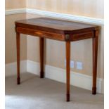A George III mahogany and satinwood card table, the rectangular cross banded top with cut corners,