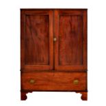 A George III mahogany small clothes press, the reeded edge top over a pair of panelled doors