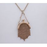 A miniature 9ct rose gold chain purse, with a snap clasp and measuring 49mm in length. Suspended