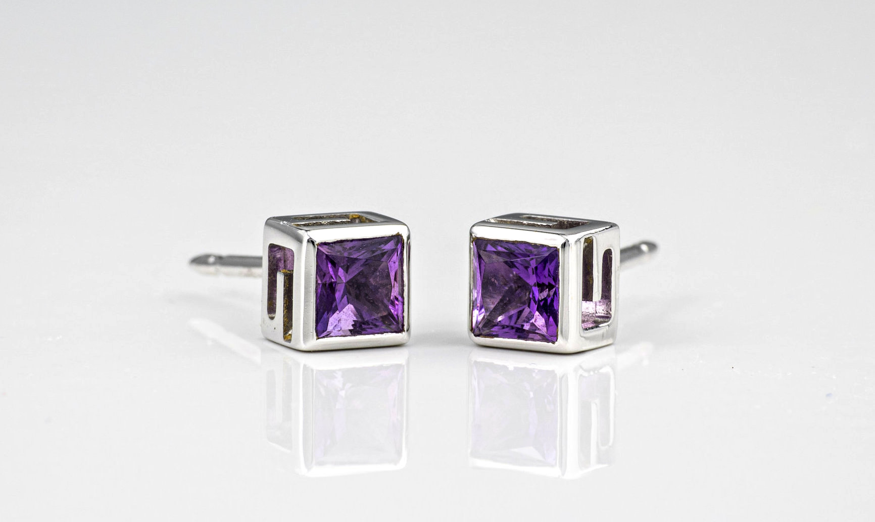 A Gucci 18ct white gold and amethyst pendant and matching stud earrings, the square cut amethysts - Image 2 of 3