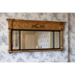 A Regency giltwood overmantel mirror, the lattice frieze centred by a shell and foliate tablet, on