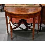 A George III mahogany demi-lune card table, requiring restoration.