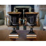 A pair of gilt brass and marble campana style urns, second half 20th century, the black marble