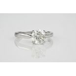 An impressive diamond solitaire ring, set in platinum, the round brilliant cut diamond totalling 1.