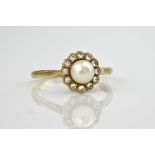 An 18ct yellow gold, cultured pearl and diamond cluster ring, the central pearl measuring