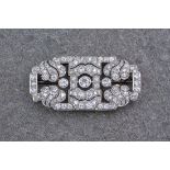 An impressive Art deco platinum and diamond plaque brooch, of finely pierced, oblong openwork