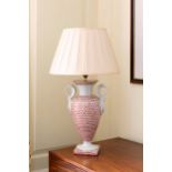 A Paris style porcelain vase lamp, late 20th century, with swan neck handles and pleated silk shade,