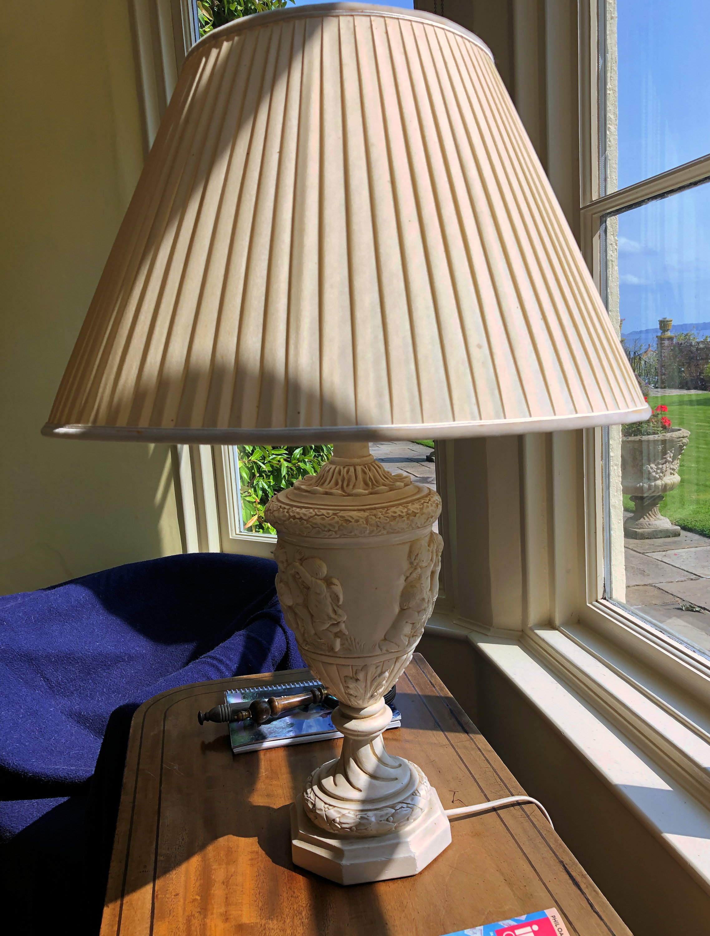 A classical style painted plaster vase lamp, with pleated silk shade, 28½in. (72.5cm.) high.