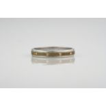 An 18ct white and yellow gold diamond set ring, with a central antiqued yellow gold band inlayed