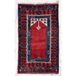 A Turkish Konya prayer rug, central Anatolia, second half 20th century, the red field with ivory
