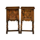 A pair of carved oak bedside cabinets, mid-20th century, the square tops over tapered cupboards with