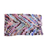 A vintage Moroccan rag rug, with multicoloured chevron design, 78 x 49½in. (198 x 125.75cm.).