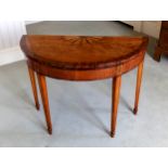 A George III satinwood demi-lune card table, the top inlaid with a fruitwood fan-shaped medallion