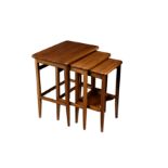 An Edwardian nest of three mahogany tables, the rectangular tops with rounded angles and barber's