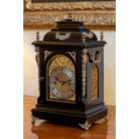 A Victorian ebonised and gilt brass mounted quarter striking bracket clock, by Winterhalder &