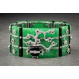 A striking Chinese style 18ct white gold, green jade, onyx, ruby and diamond cuff bracelet by